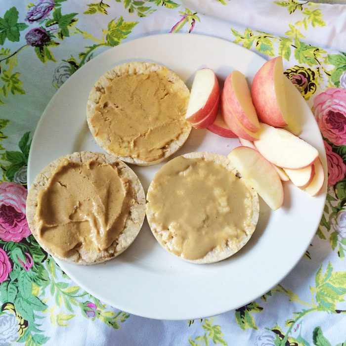 Corn cakes with nut butter and sliced apple