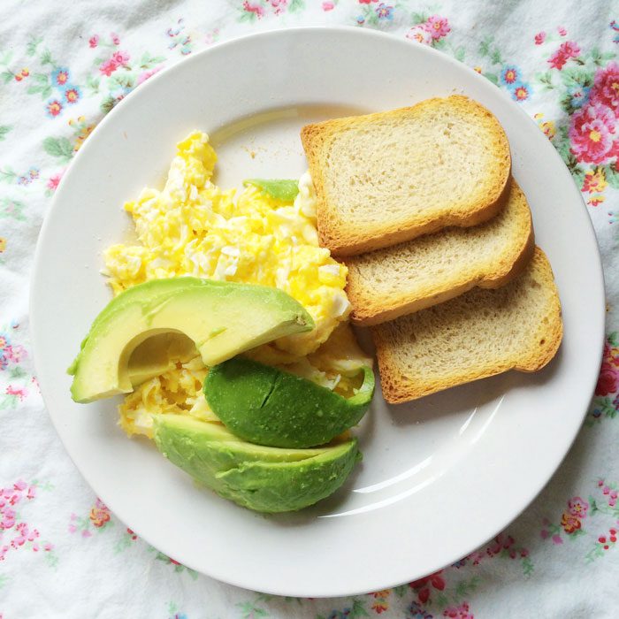 Scrambled eggs avocado and spelt melba toast