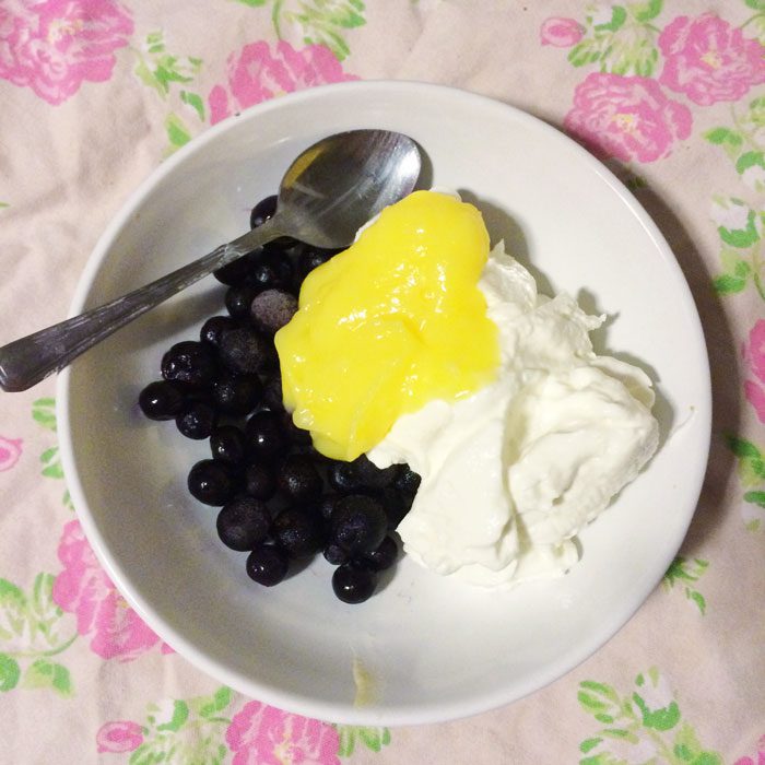 Blueberries lemon curd and yoghurt