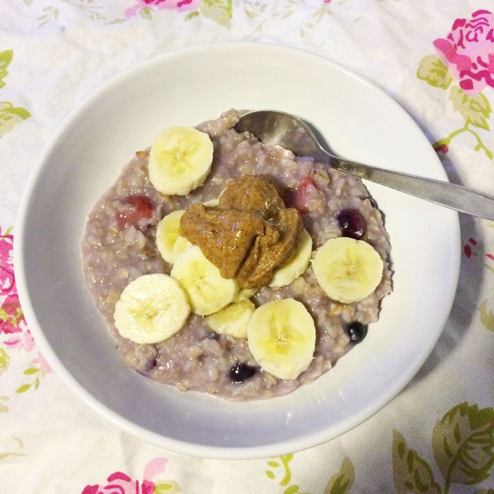 Porridge with berries banana and nut butter