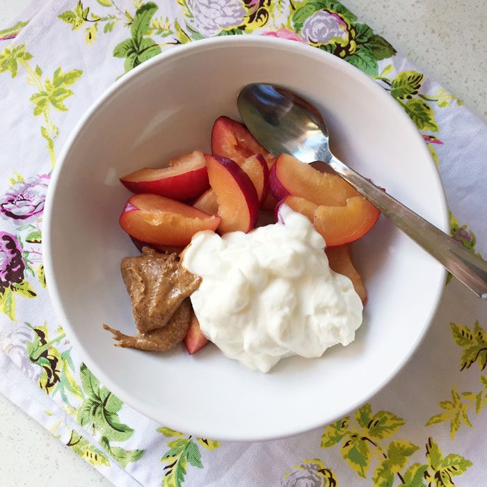 Plums with greek yoghurt and almond butter