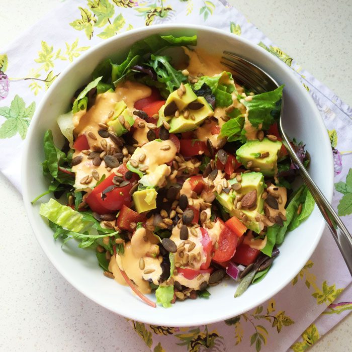 Veggie salad with hummus and avocado