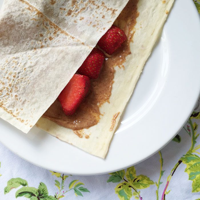 Mountain bread wraps with peanut butter and strawberries